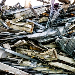 Scrap, metal and aluminium pressed together i a pile of metal junk